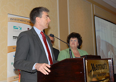 NSA Deputy Director John C. Inglis accepts the 2010 Employer of the Year Award from the BWI Business Partnership. Catherine S. Hill, NSA's director of state and local government and community relations, looks on. (Source: NSA)