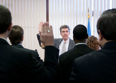 Picture of Deputy Director  NSA John C. Inglis  raising right hand to lead oath.