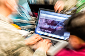 Abstract photograph of person typing code